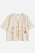 Blusa anudada con bordado